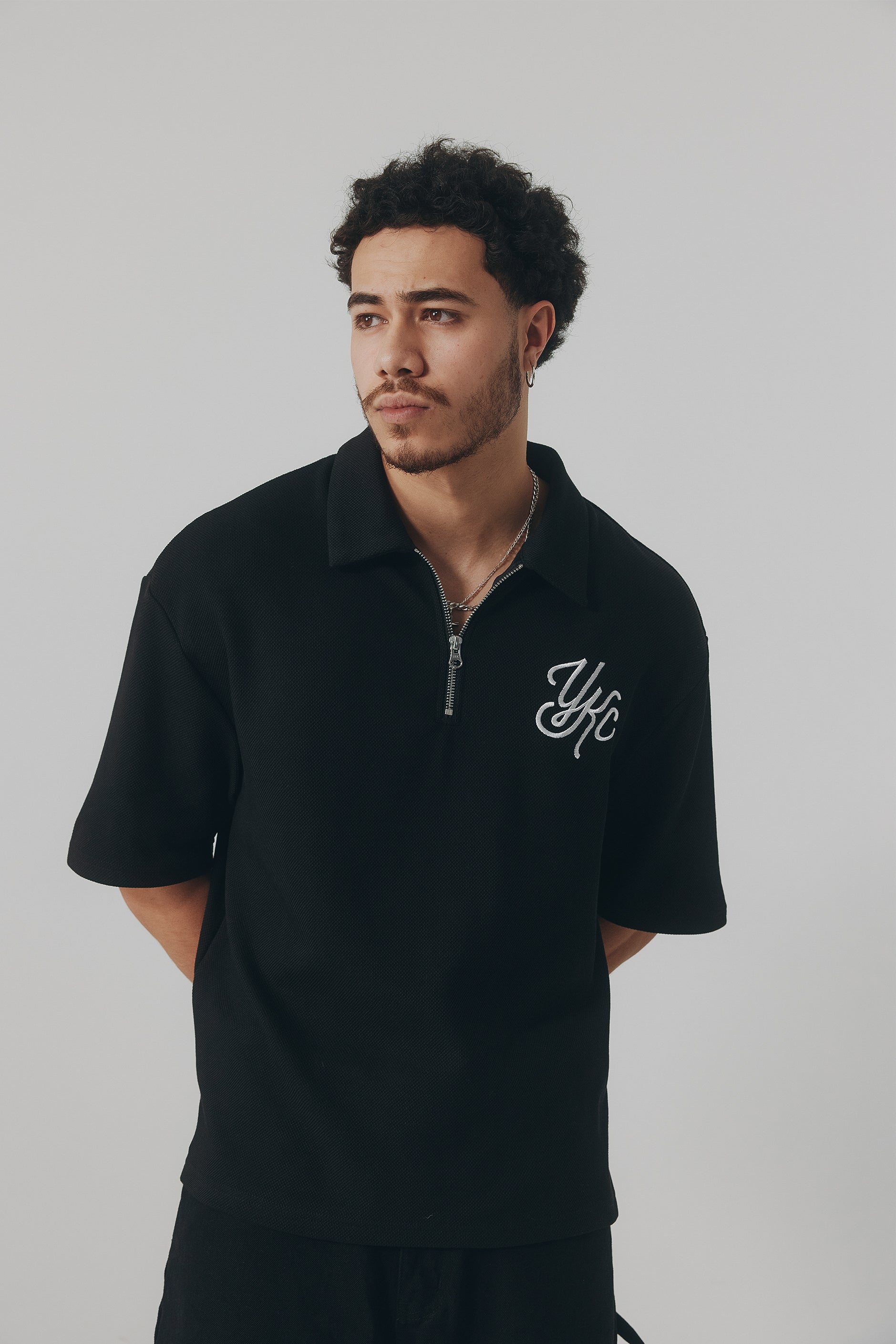 QUARTER ZIP POLO | BLACK